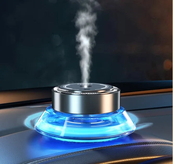 Smart spray car air freshener unit with refillable design, shown with fragrance refill bottle.