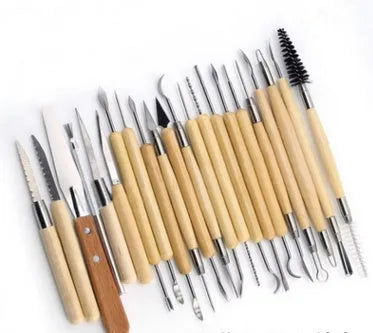27-piece pottery clay tool set with roll bag containing wood and stainless steel sculpting tools