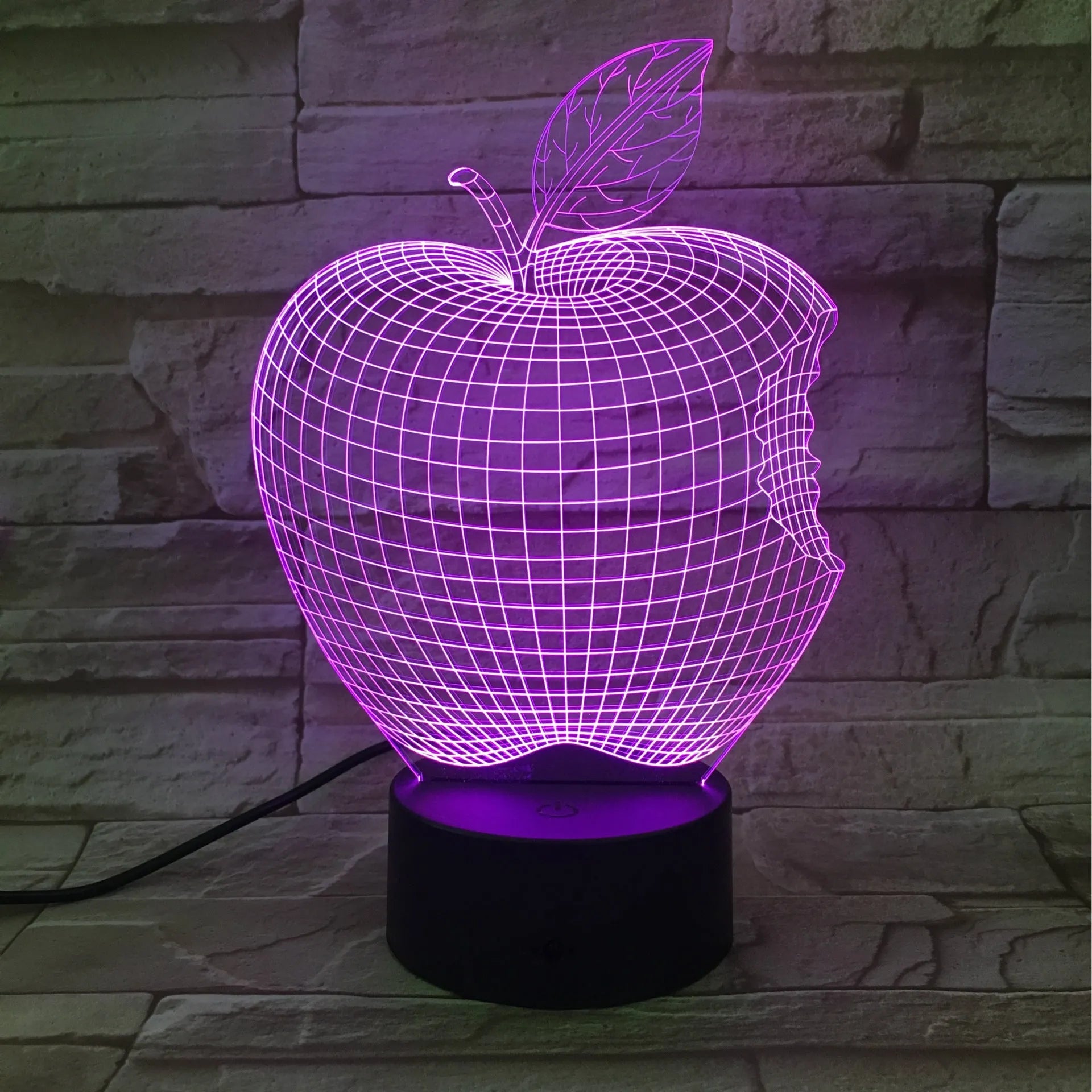 3D fruit-shaped colourful night light with acrylic shade and touch control on a surface.