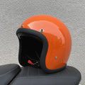 A retro-style fibreglass half motorcycle helmet shown in a cement grey colour, suitable for adult commuting.