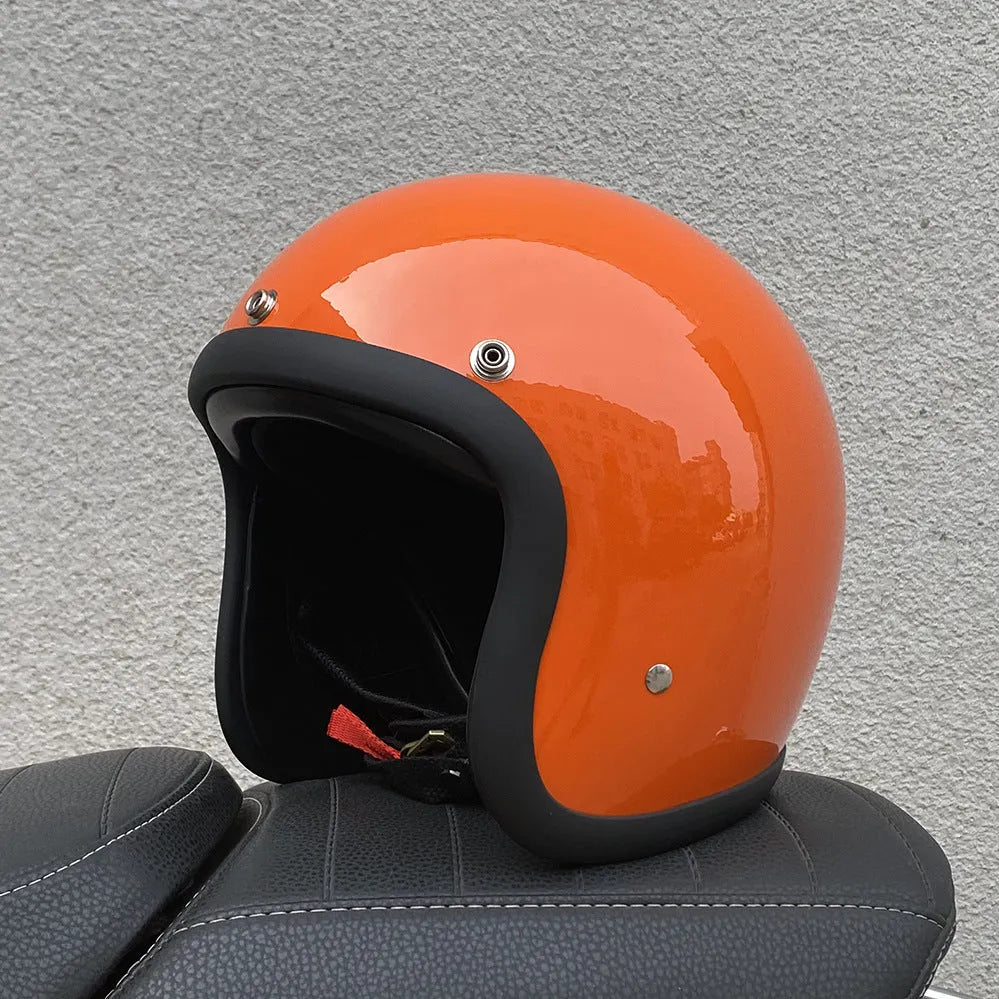 A retro-style fibreglass half motorcycle helmet shown in a cement grey colour, suitable for adult commuting.