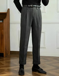 Grey straight-leg high-waisted trousers on hanger showing front slant pockets and waistband detail