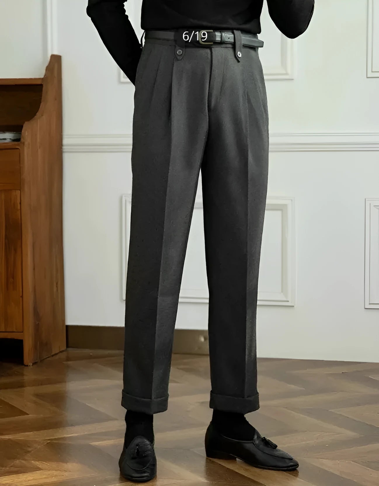 Grey straight-leg high-waisted trousers on hanger showing front slant pockets and waistband detail