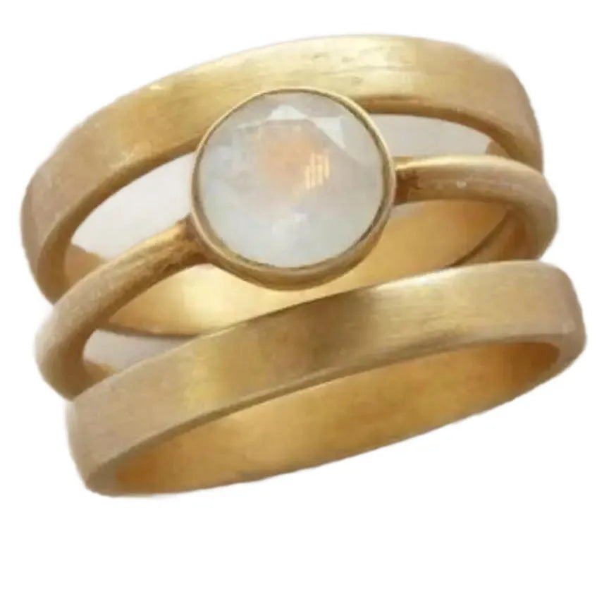 Gold-plated hollow geometric titanium steel ring with micro-inlaid white chalcedony stone detailing.