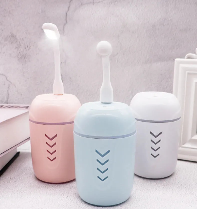 Portable car humidifier with columnar design in blue, pink, or white colour options