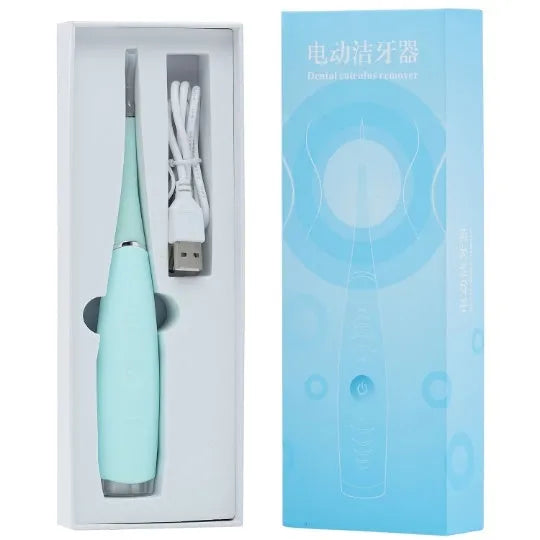 Pink and blue waterproof electric tooth scaler with integrated handle on a bathroom counter.