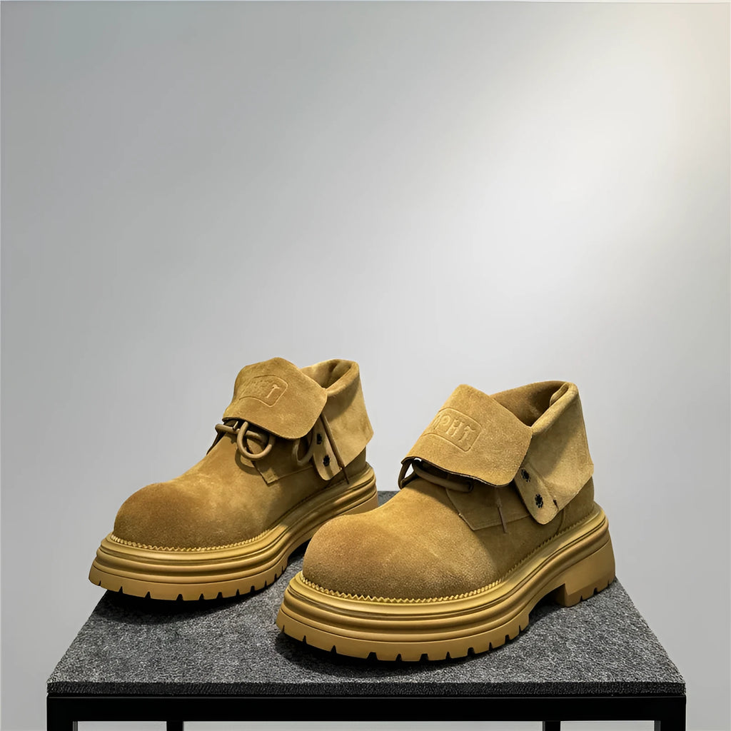 Distressed cow suede worker boots with thick soles and retro sewing detail in camel colour
