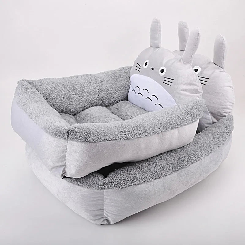 Blue cartoon-style washable pet bed with raised sides and soft fleece interior for small dogs or cats.