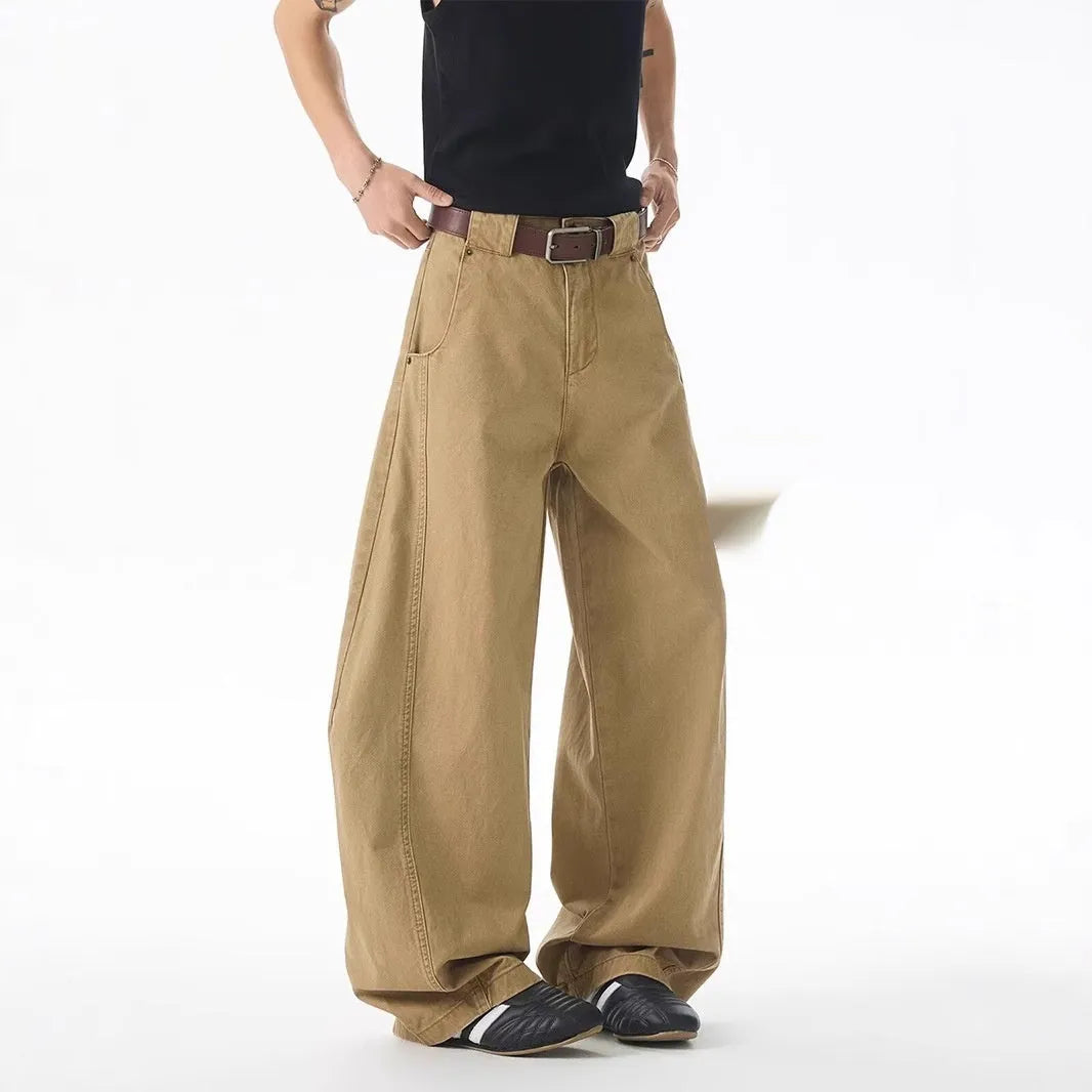 Men's brown loose fit straight leg casual jeans with a button fly and mid waist.