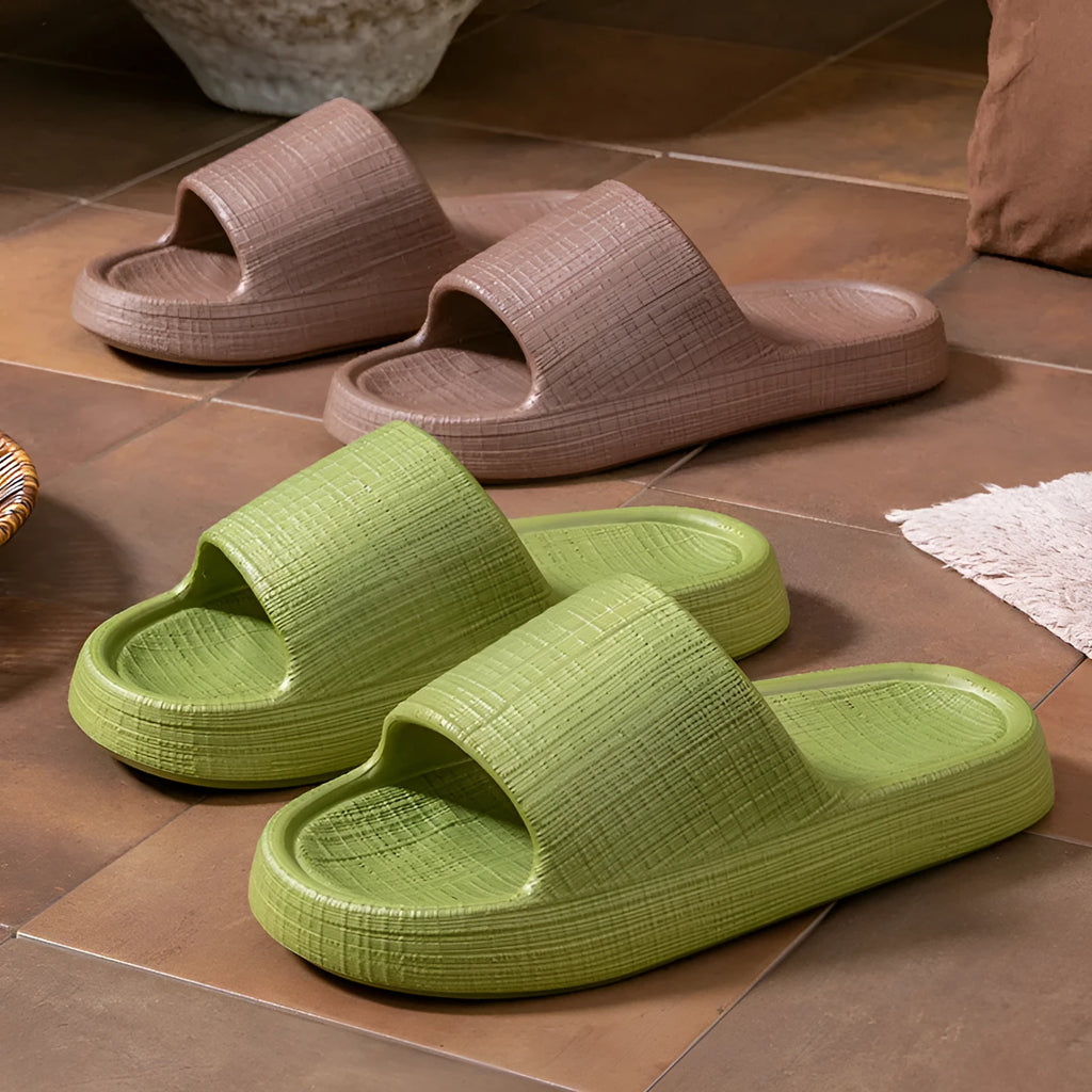 Pair of adult unisex EVA toe-ring slippers in a chosen colour, showing the non-slip sole and flip-flop design.