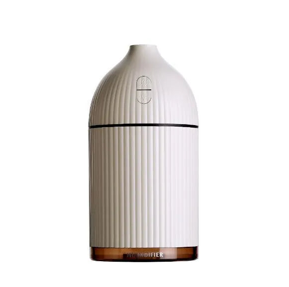 White ultrasonic aromatherapy diffuser with LED light, 300ml water tank, and USB cable.