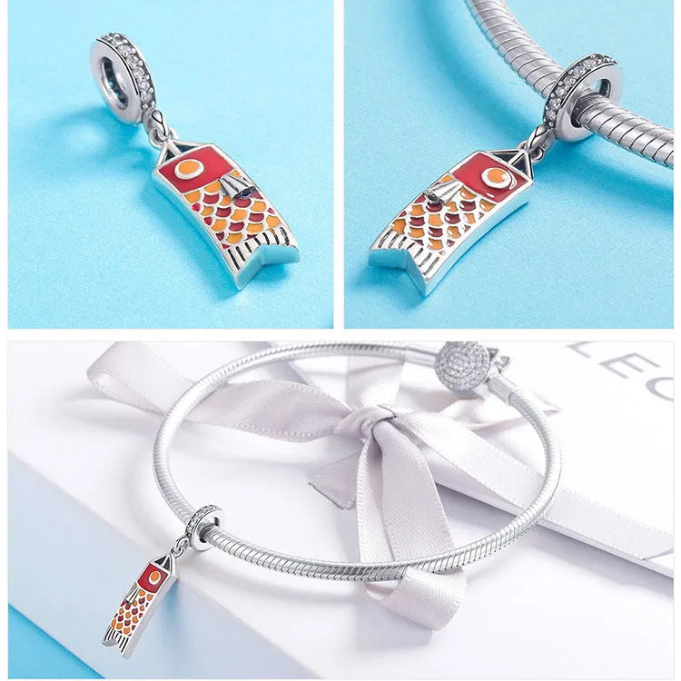 S925 sterling silver carp streamer pendant necklace with zircon stones and oxide detailing.