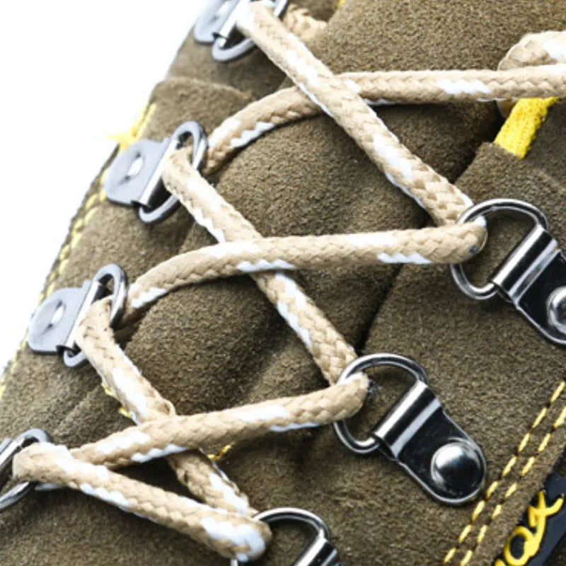 Bronze cow suede unisex safety work boots with a steel toe cap and patterned non-slip sole.