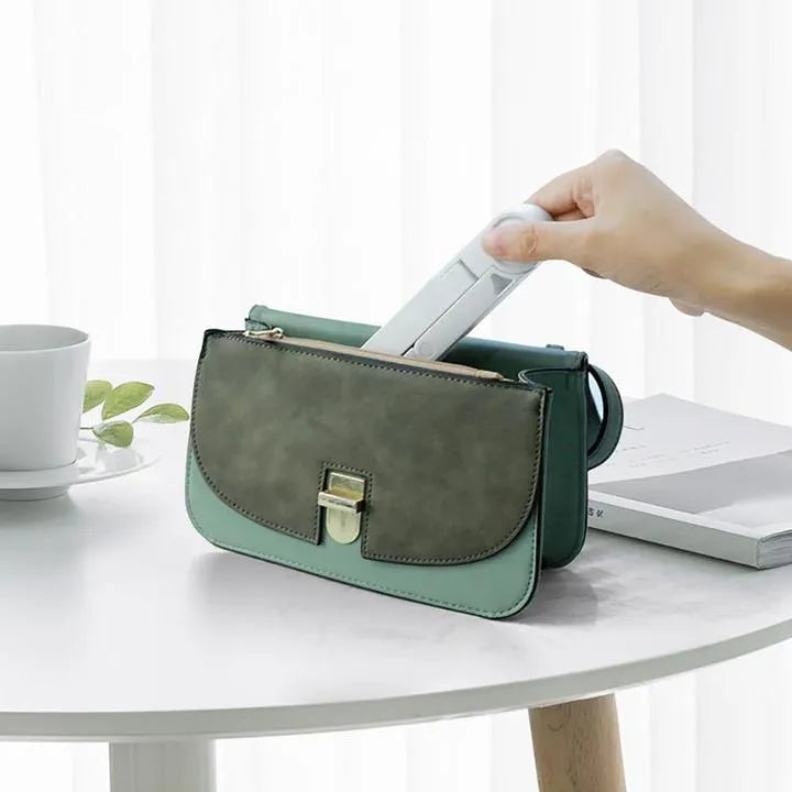Black foldable tablet holder showing folded size and non-slip rubber surface for device protection