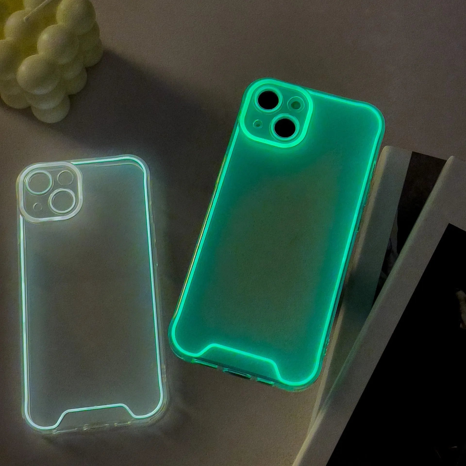 Glow in the dark soft TPU protective case for Apple iPhone on a dark background