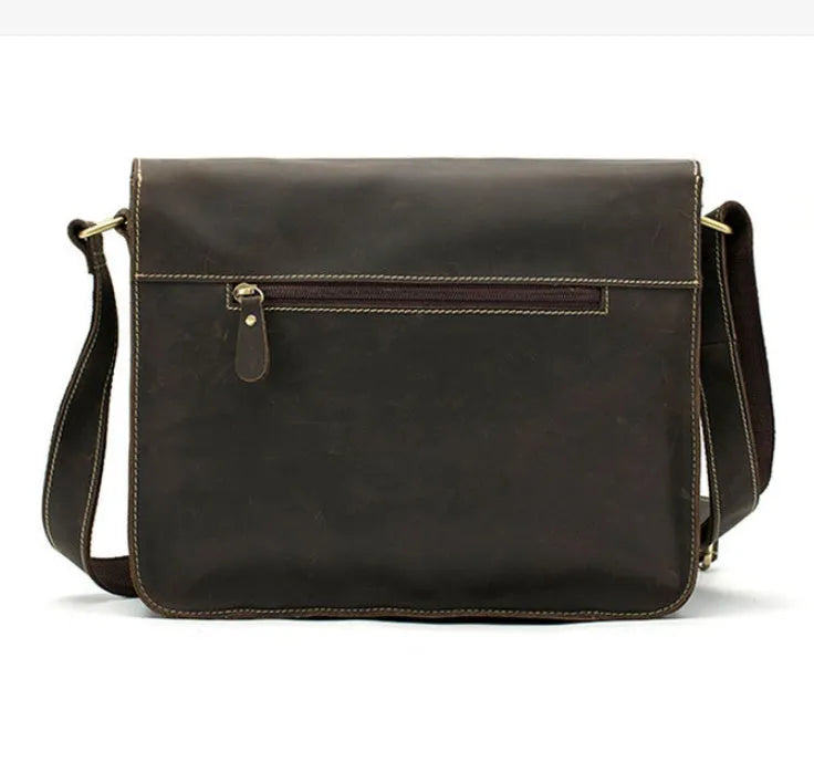 Brown leather vintage messenger bag with a flap closure and adjustable crossbody strap.
