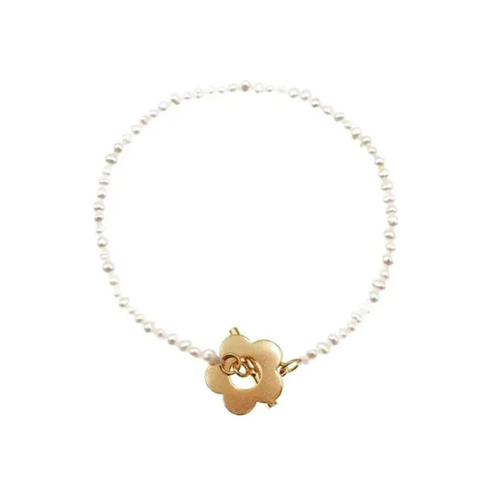 Sterling silver natural pearl flower bracelet with irregular pearl beads, handmade, adjustable size, on a white background