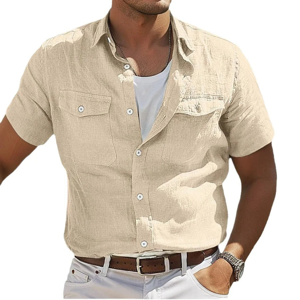 Men's grey loose fit long sleeve linen shirt with a polo collar on a plain background.