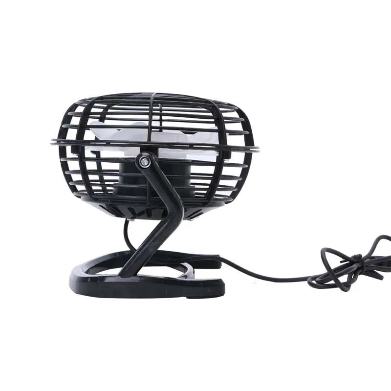 Mini USB desk fan with adjustable angle in black colour beside laptop
