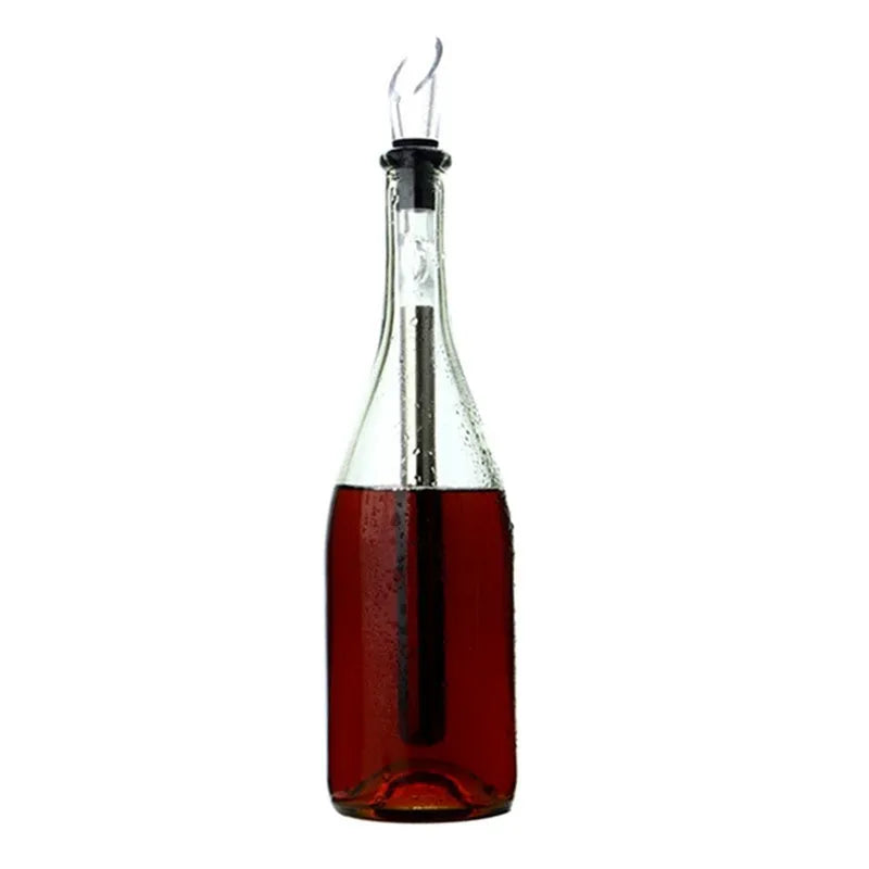 Stainless steel wine chilling rod with acrylic pourer, shown next to a wine bottle.