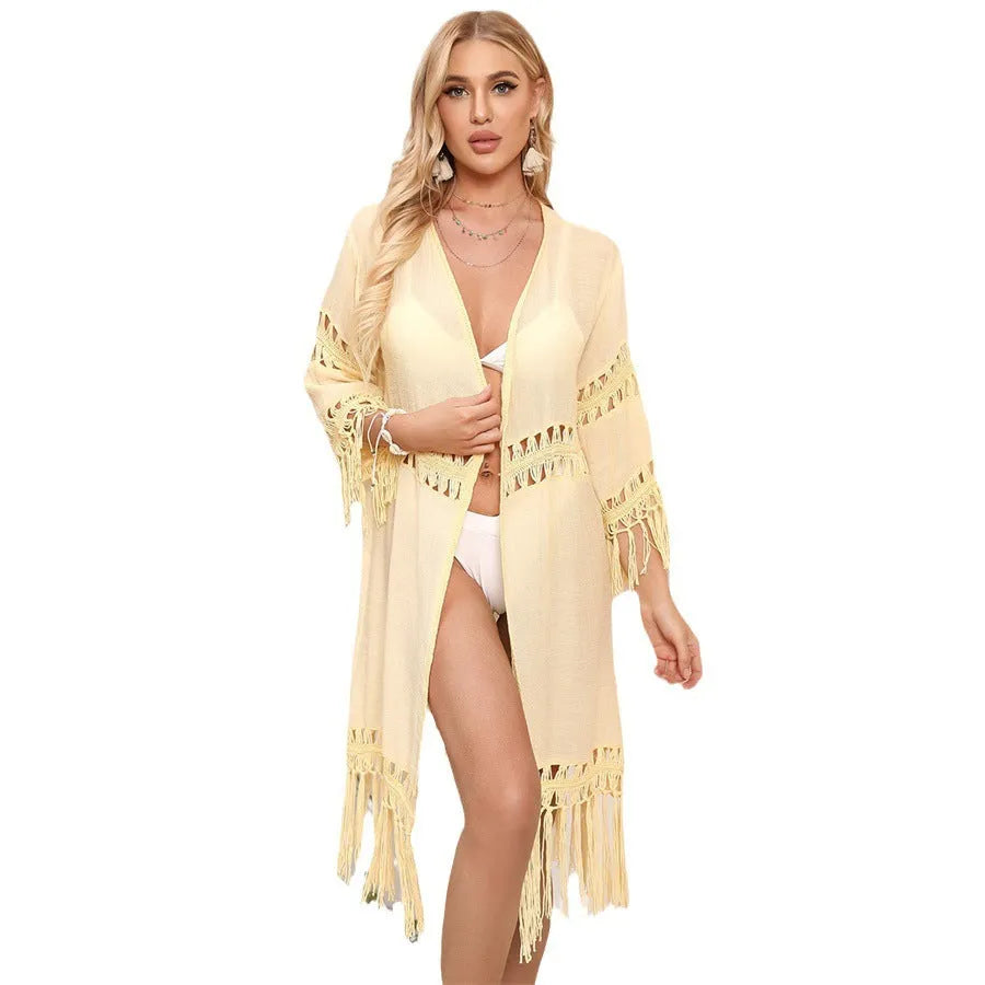 Yellow loose-fitting crochet cardigan with tassels, a women's beach cover-up.