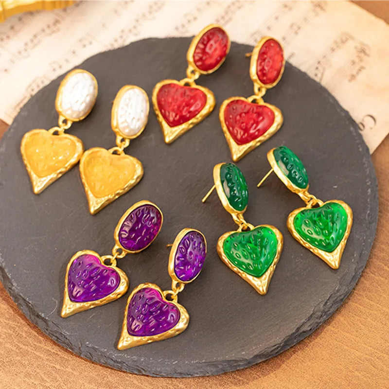 Oval love heart stud earrings with pleated texture in purple, red, green, and yellow white colours.