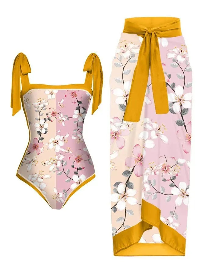 Women's printed two-piece chiffon swimsuit with a matching hip skirt in a floral design.