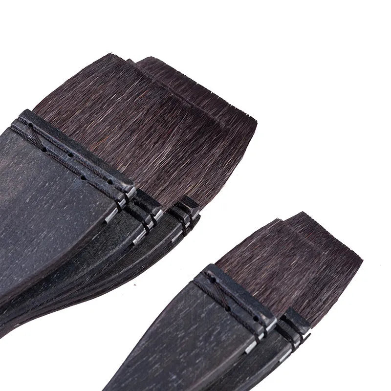Set of five grey squirrel hair artist paintbrushes with natural wood handles, showing different sizes.