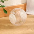 Clear blue slow feed ball for dogs and cats with small openings for treat dispensing