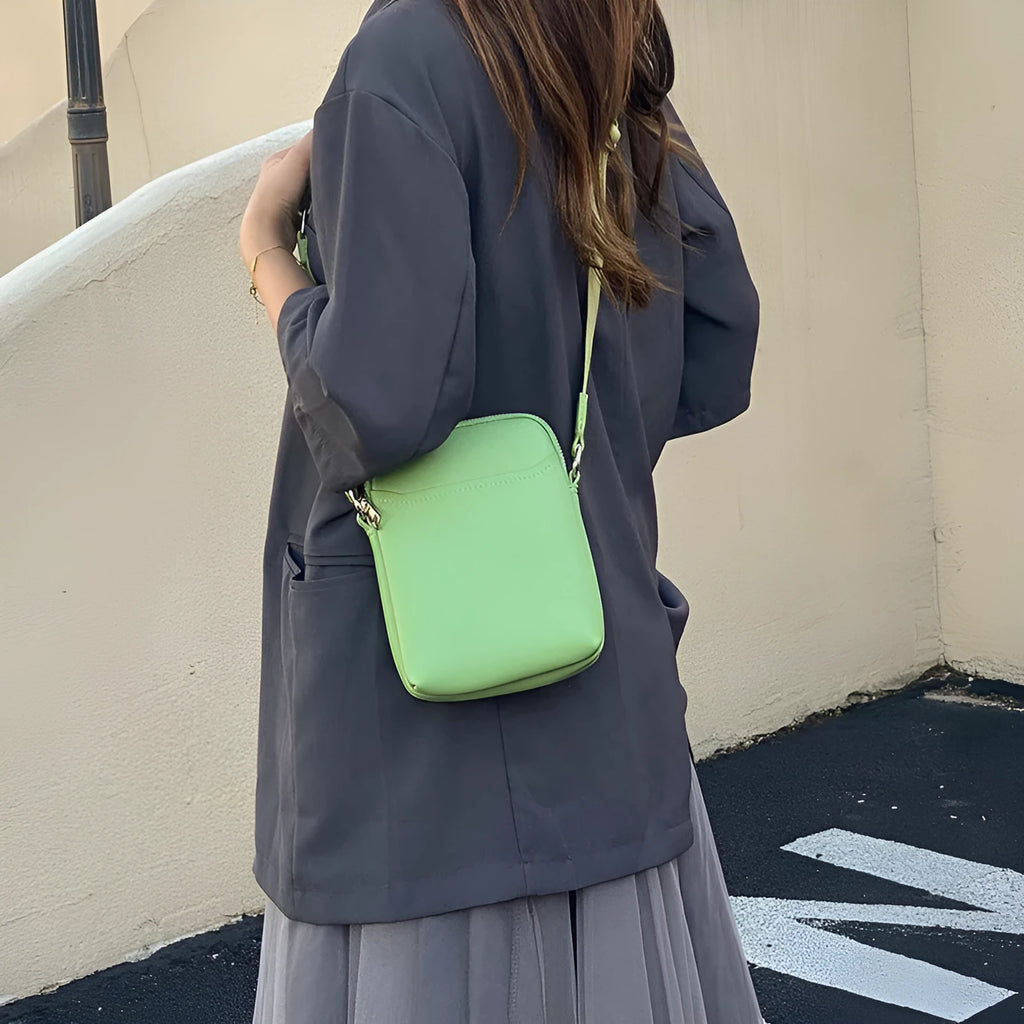 Solid colour mobile phone crossbody shoulder bag in PU material showing front view