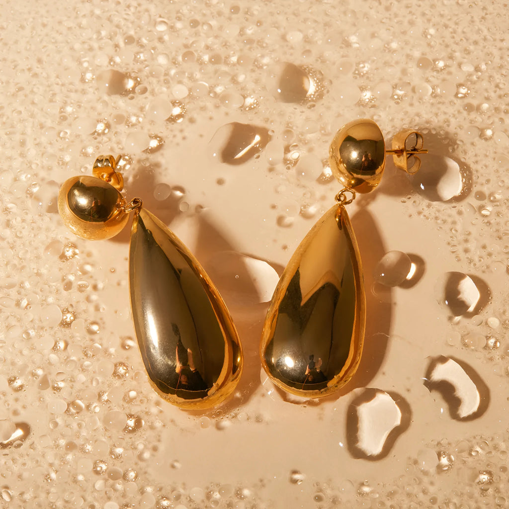 Gold electroplated stainless steel water droplet earrings with geometric hemisphere pendant design