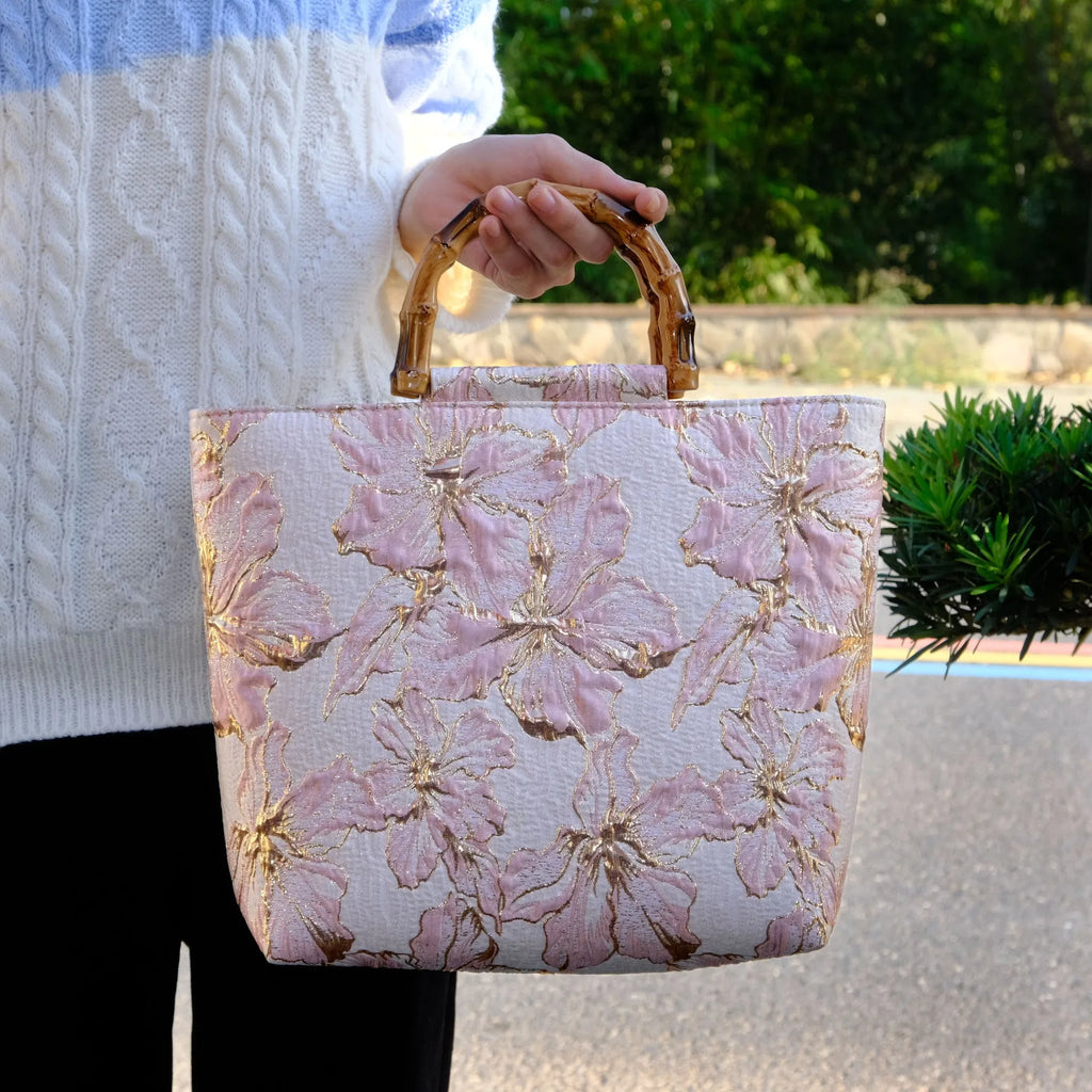 Women's light blue canvas bag with bronzing flower detailing and double shoulder straps
