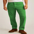A pair of loose straight-leg corduroy trousers in an army green colour, laid flat.