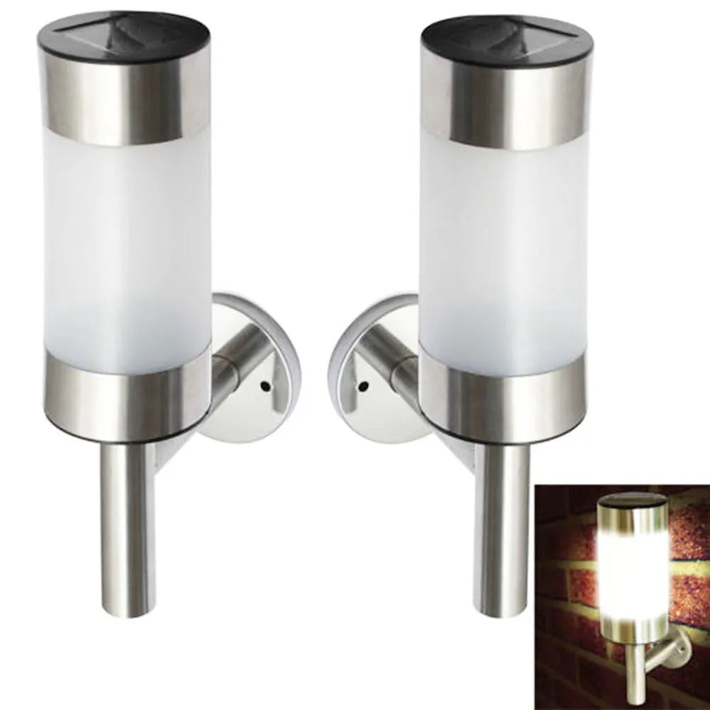 White solar-powered outdoor wall light with solar panel on top, showing plastic and stainless steel construction.