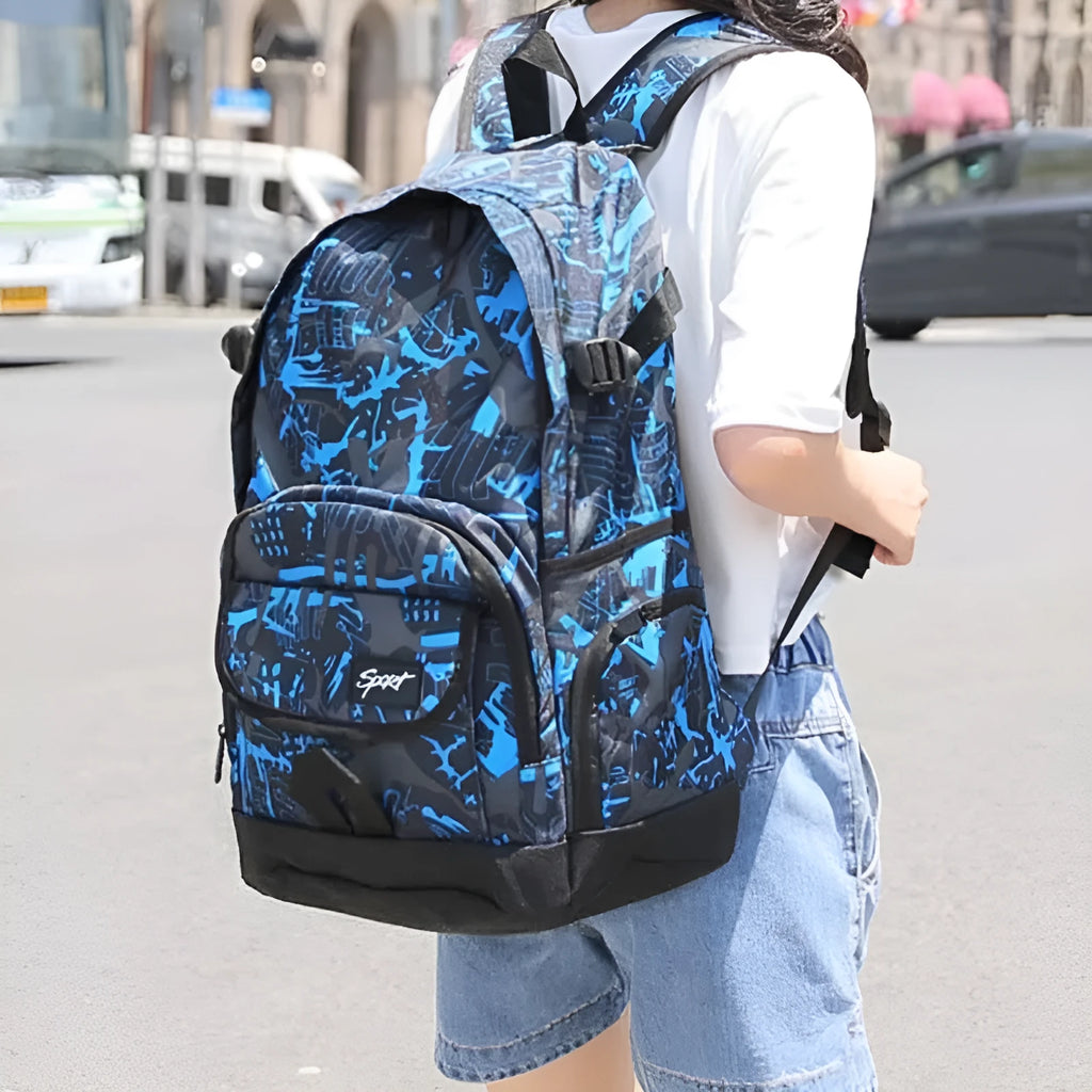 Blue classic nylon backpack with large main compartment and adjustable padded shoulder straps.