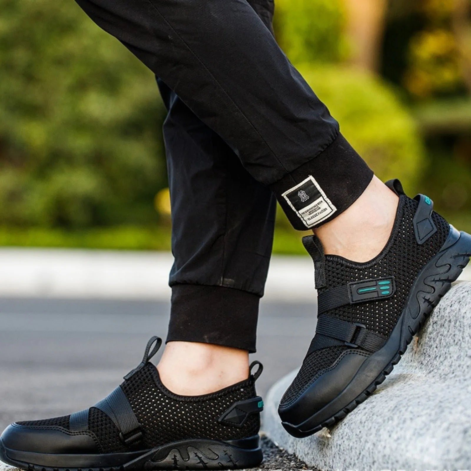 Men's grey anti-smash and anti-puncture insulation safety work shoe with a woven upper and rubber sole.