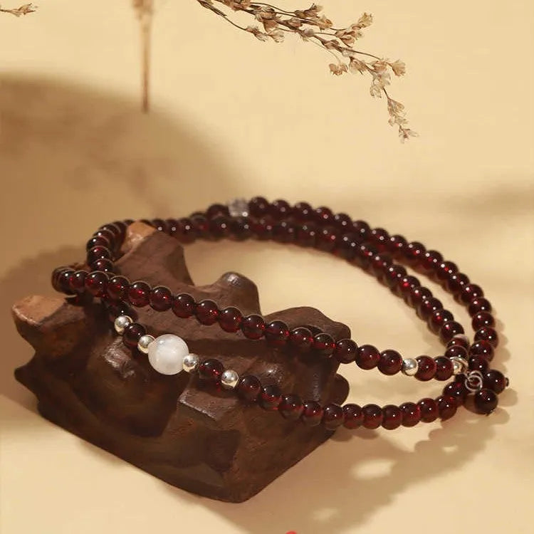 Chinese-style garnet bracelet with U-shaped design and pomegranate elements in antique style