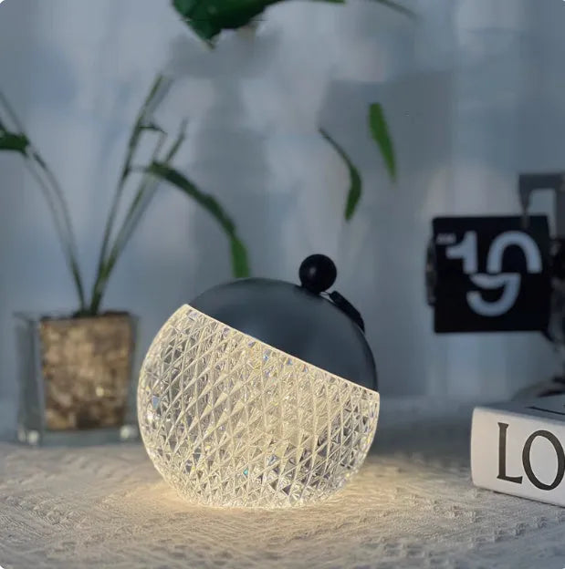 Small round touch-controlled desk lamp in aluminium and acrylic with dimmable LED lighting