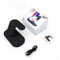 Three-in-one wireless charging station in black, charging a mobile phone, a smartwatch, and wireless headphones.