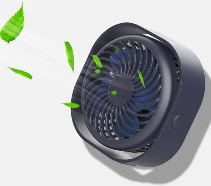 Blue USB desk fan with alarm clock display and plastic blades on a white desk.