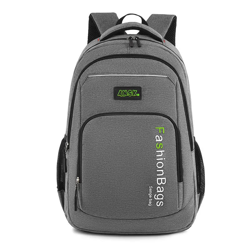 Street style nylon backpack in grey showing internal laptop compartment and organiser pockets.