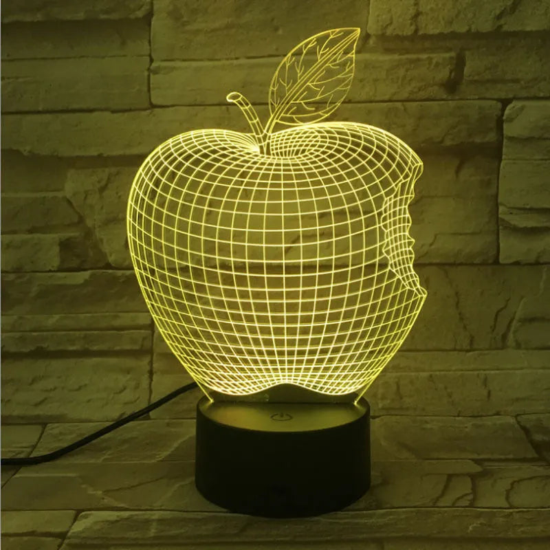 3D fruit-shaped colourful night light with acrylic shade and touch control on a surface.