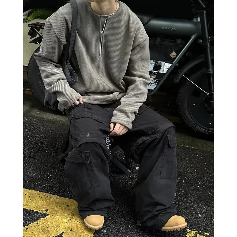 A solid colour loose pullover top with long sleeves, shown in apricot, grey and black.