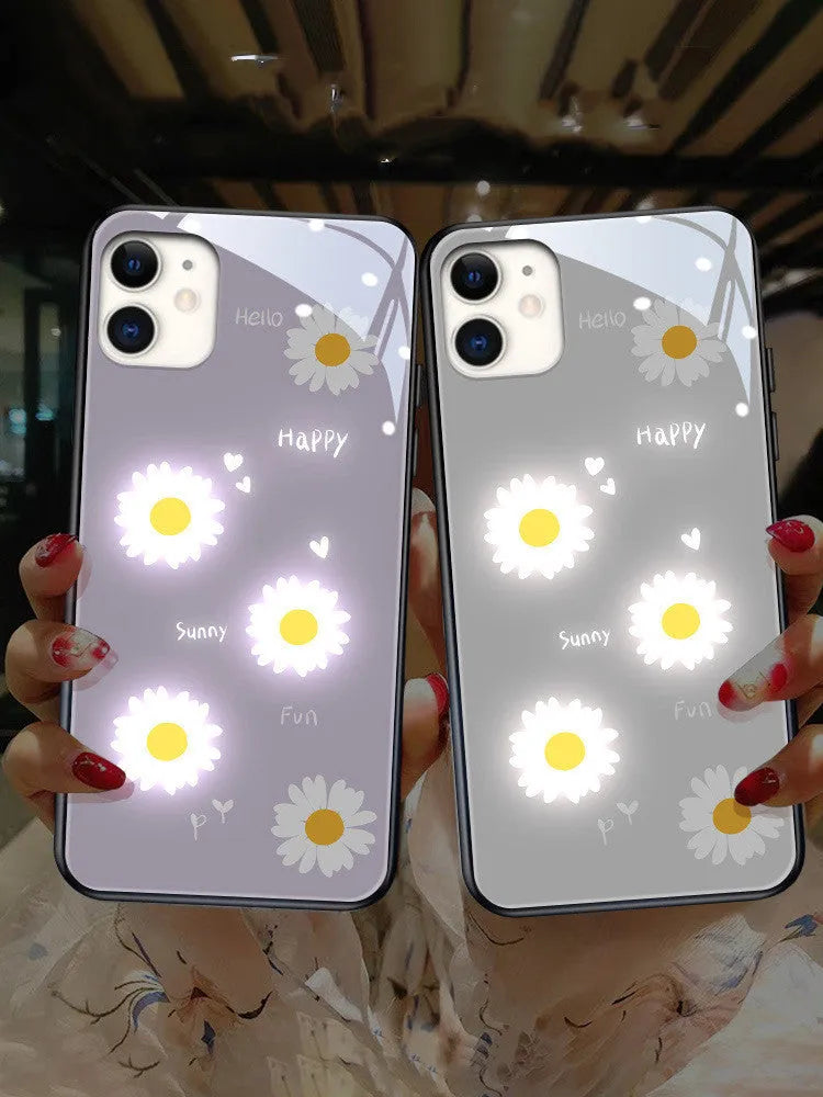 Luminous iPhone case with white daisy design and voice-activated colour lighting on a phone