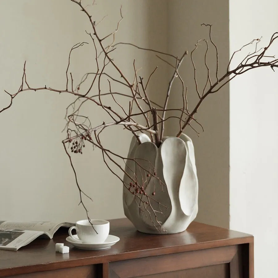 Irregular shaped art ceramic vase for flower arrangements in low and high style options.