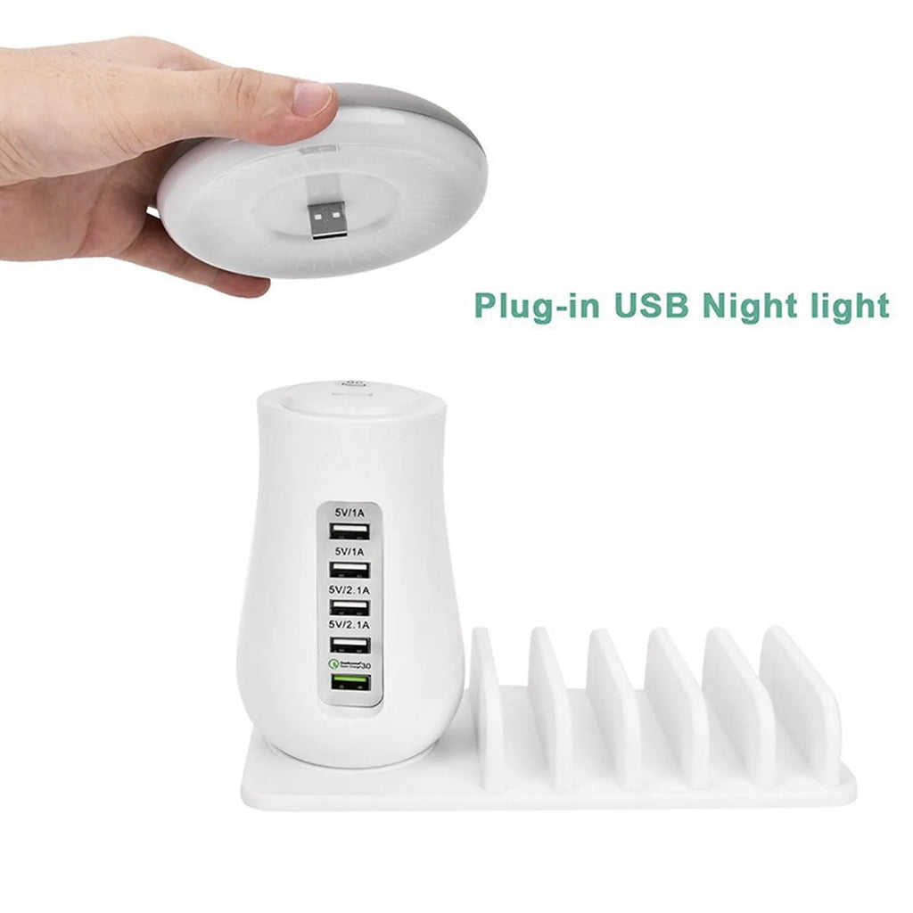 White mushroom-shaped USB charging dock station with five ports and integrated LED night light on a desk.
