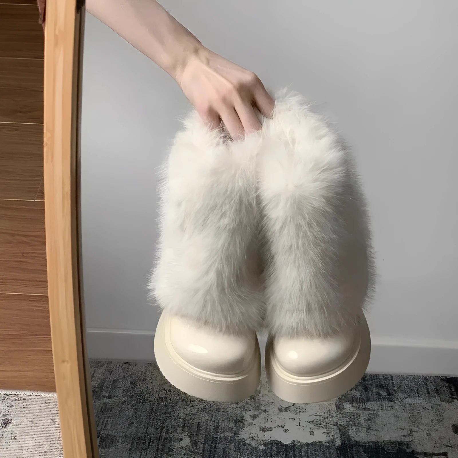 Women's black fleece-lined low-top snow boots with a waterproof rubber platform sole on a white background.