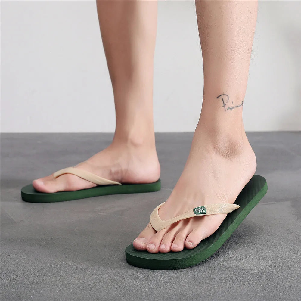 Men's black flip-flop slippers with EVA upper and rubber sole on a plain background.