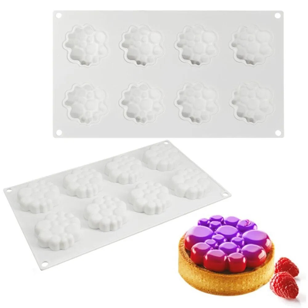 Round silicone baking mould with eight raised bubble cavities for tower cakes.
