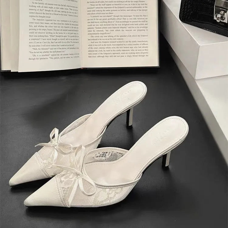 Light brown women's lace high heels with a pointed toe and a decorative bowknot on the upper.